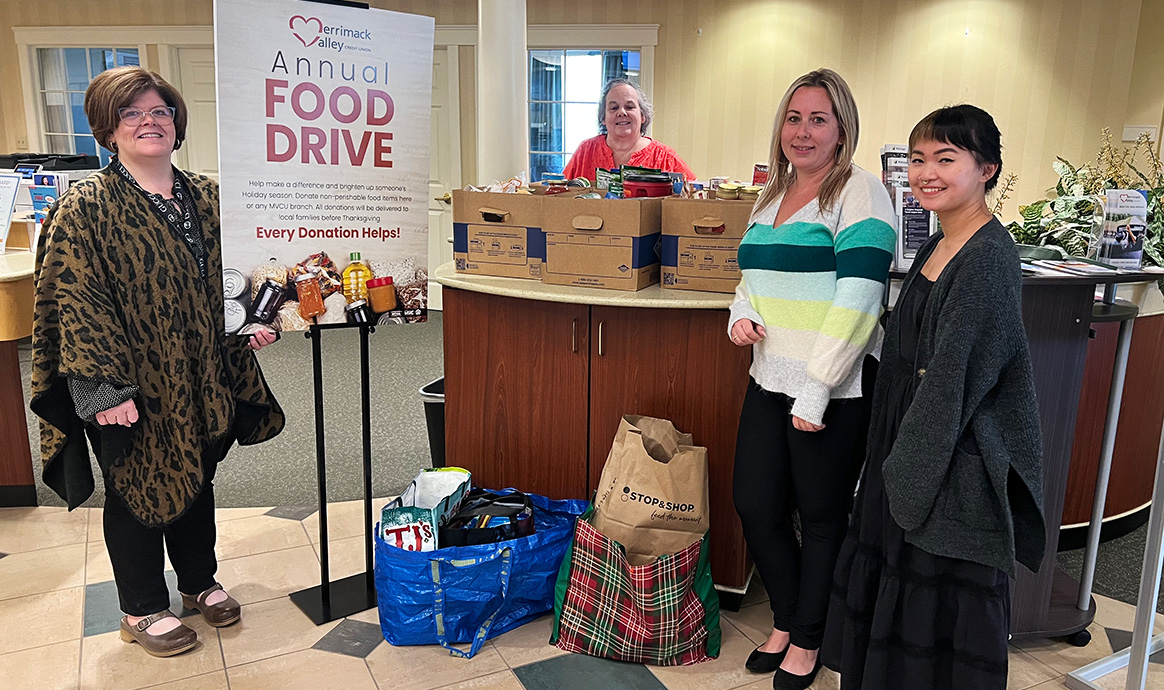 MVCU staff members smile next to generous food donations at the credit union’s Bridgewater branch. 
