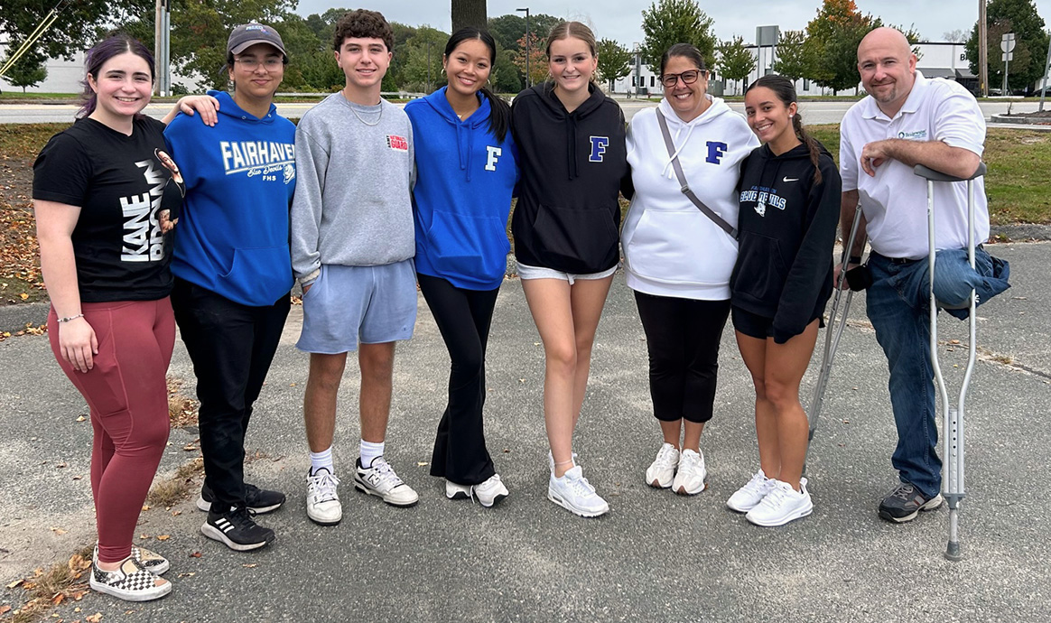 Several members of the FHS class of 2025 join Fairhaven Branch Manager Jon Bewsher (far right) and FHS Parent Class Advisor Tracey Francis (third from right).
