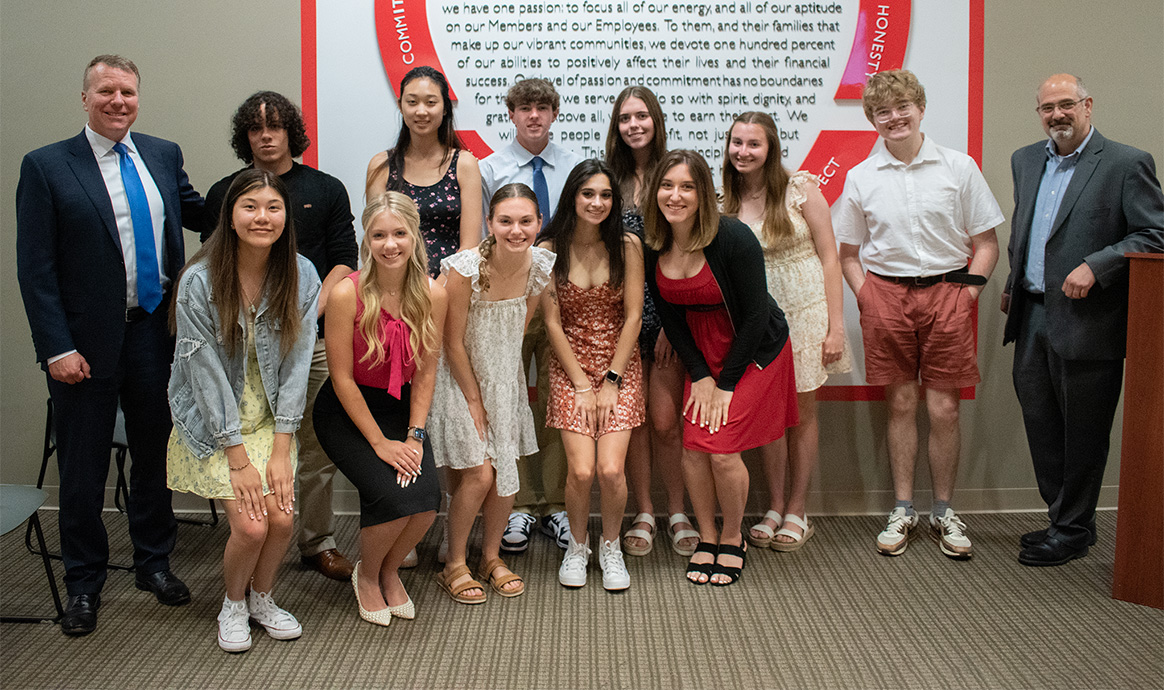 MVCU President & CEO John J. Howard (left) and Brad Goodman (right) with this year’s scholarship recipients.